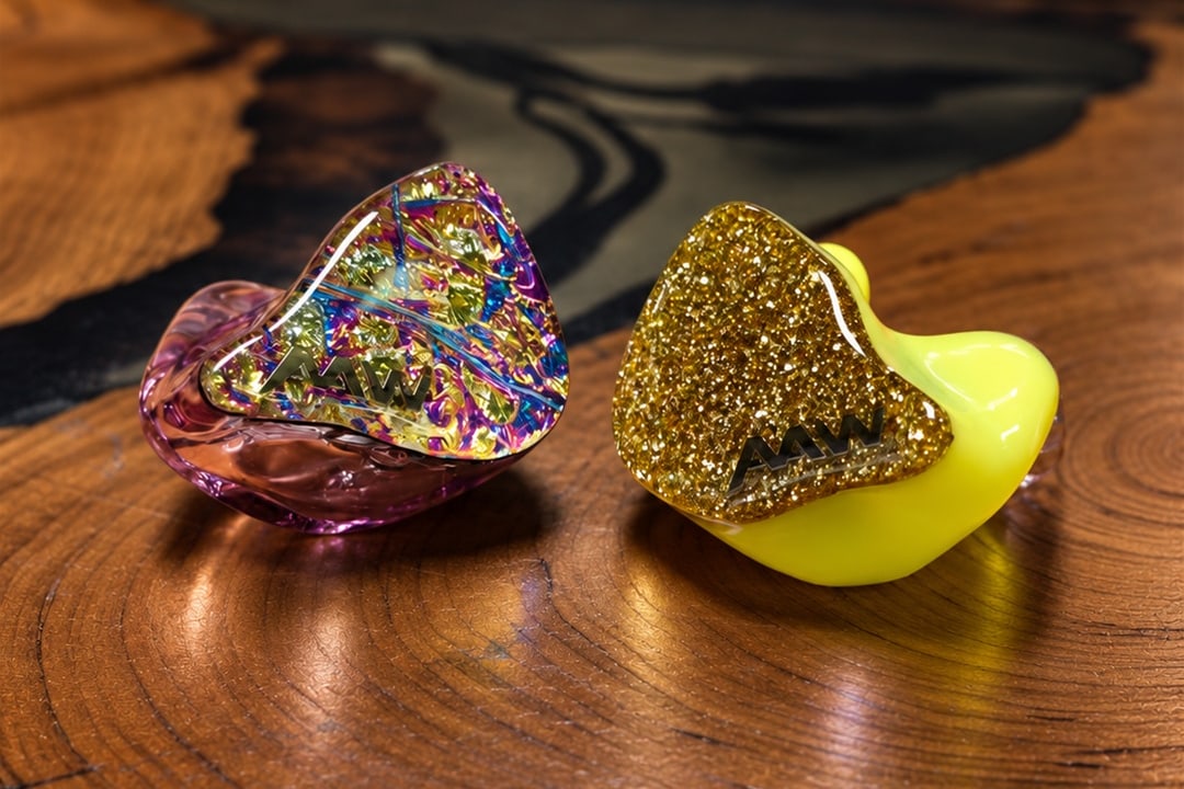 AAW custom IEM finish example: iridescent foil and gold glitter faceplates on pink and yellow shells
